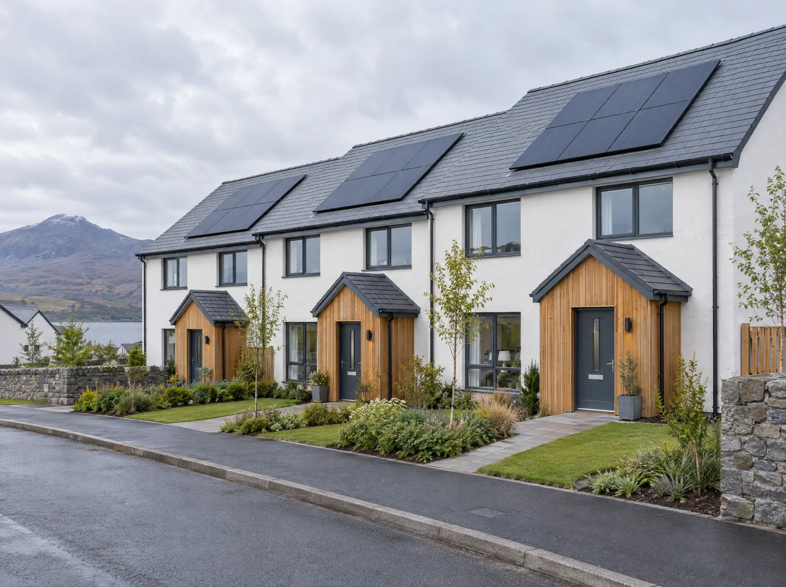 A terrace of new homes with roof-mounted solar panels (illustrative image)